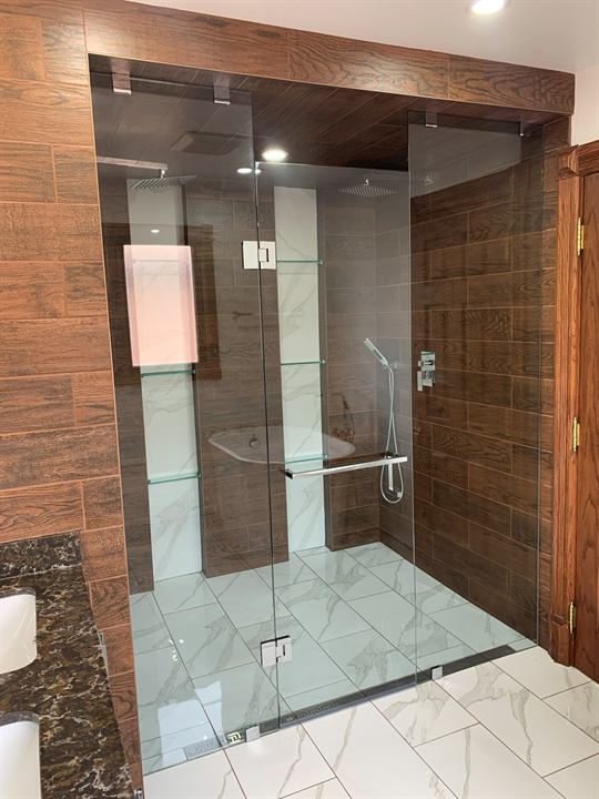 Large walk-in shower with wood-look and marble-look porcelain