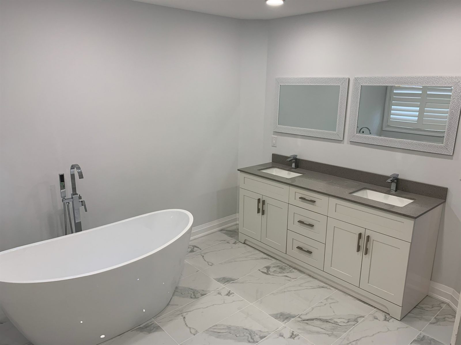 Master bathroom renovation with freestanding tub and double vanity